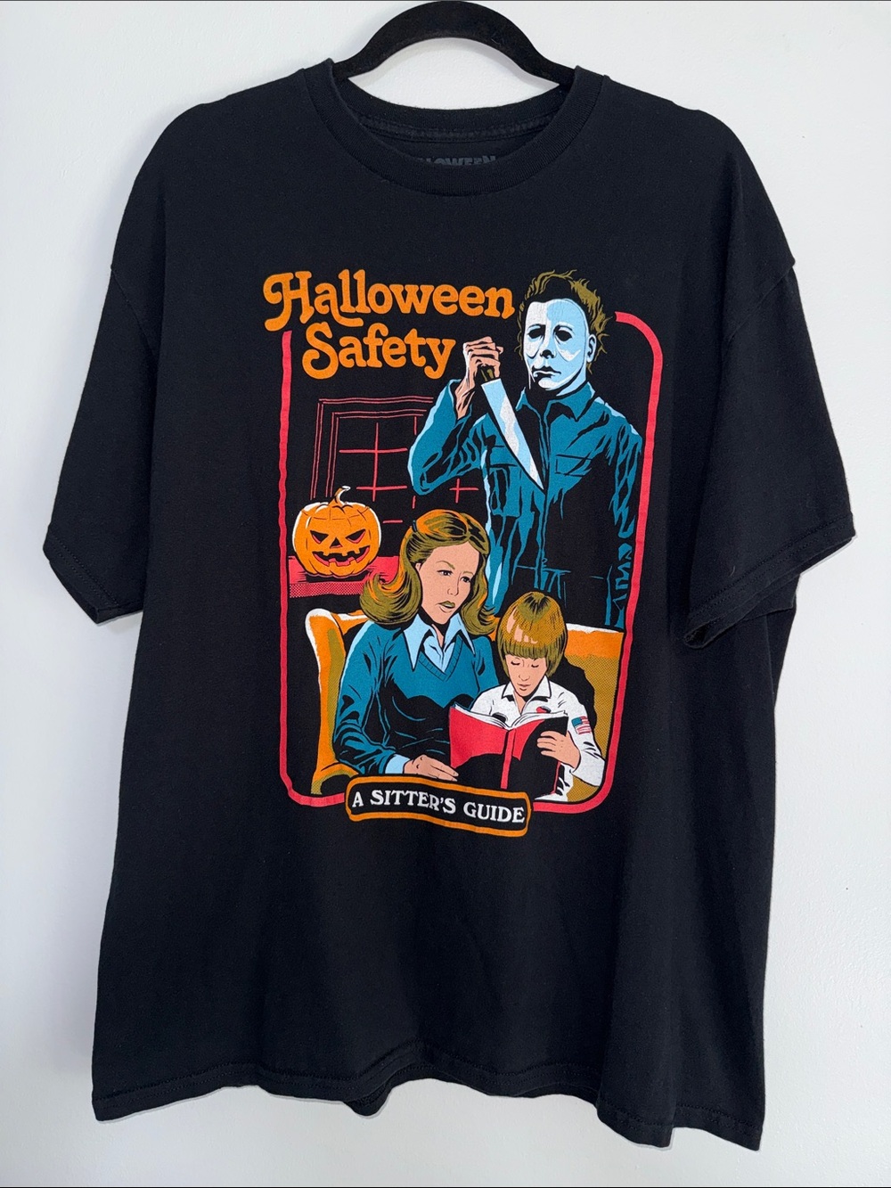 Spencer's Black Halloween Safety Graphic Tee with Orange and Blue Print